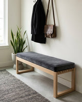 Charcoal velvet cushion on an oak entryway bench