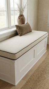 Cream box cushion with brown piping on a white storage bench