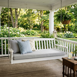 Light gray cushion on a white porch swing