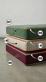 Stacked linen bench cushions labeled with fabric and piping color codes