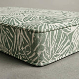 Green and cream leaf-print outdoor cushion corner