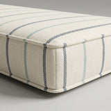 Cream outdoor cushion with blue pinstripes