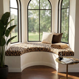 Zebra print cushion on a curved bay window seat