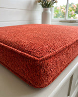 Close-up of a red textured cushion corner