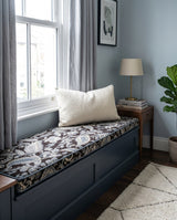 Navy paisley cushion on a dark blue window bench