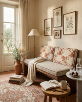 Rust floral back cushions on a bench with a cream throw