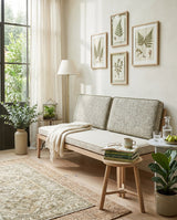 Sage textured back cushions and cream seat cushion on an oak bench
