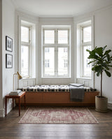 Black and white patterned cushion on a bay window bench