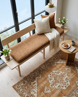 Camel cushion on an oak bench with a backrest